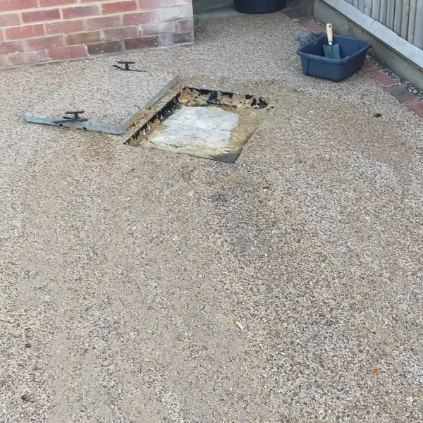 Blocked and overflowing external drain with the chamber cover lifted